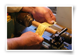 Jim Downes finishing a custom turned cork grip in the Rod Shop behind The Feathered Hook in Coburn, Pennsylvania.