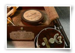 Custom bamboo fly rods French Walnut reel seat and Carpenter & Casey prototype reel (left) and Ted Godfrey reel with American Walnut real seat (right). Terenzio silk line, leaders, grease and classic box behind.